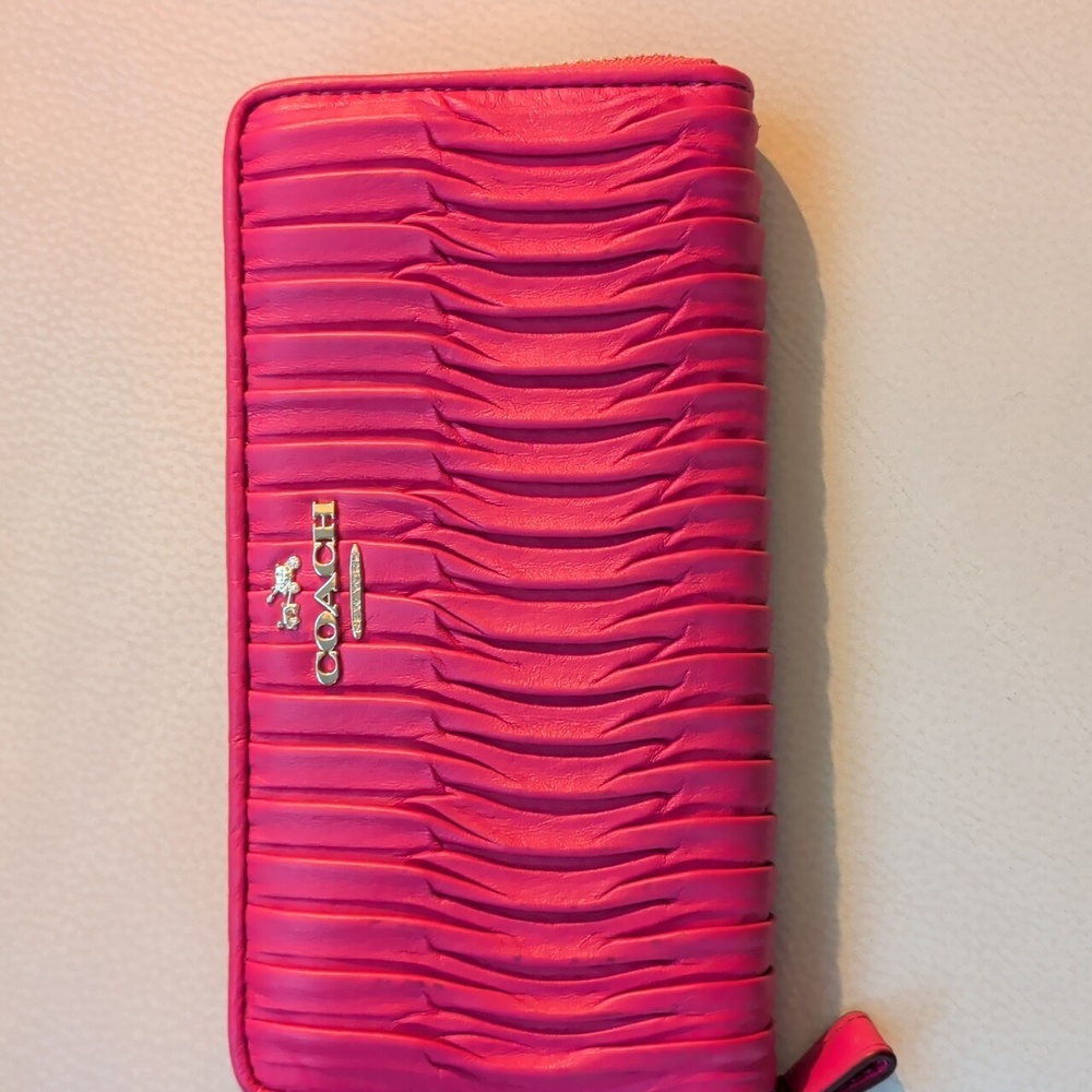 Authentic Coach in twisted Hot Pink leather